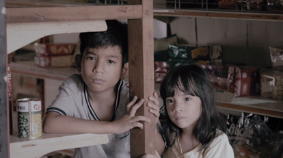 A brother and sister are in a food store; image used for HSBC Project Azim dan Adik