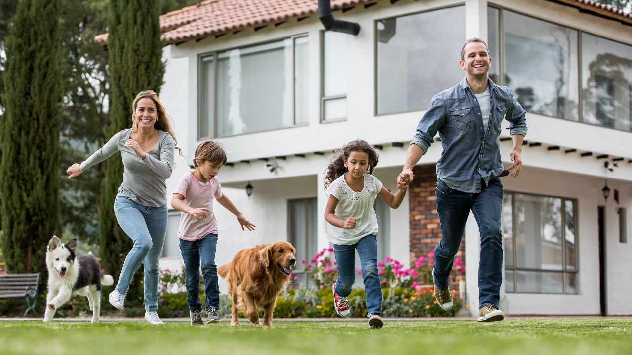 A family is playing with their dog; image used for HSBC Malaysia Moving to Malaysia service