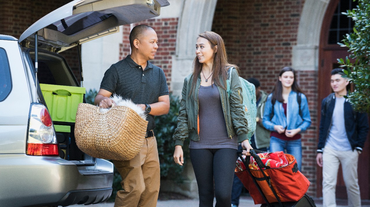 A father is helping his daughter move into her dormitory; image used for HSBC Malaysia Premier Education Help Your Children Study Abroad article