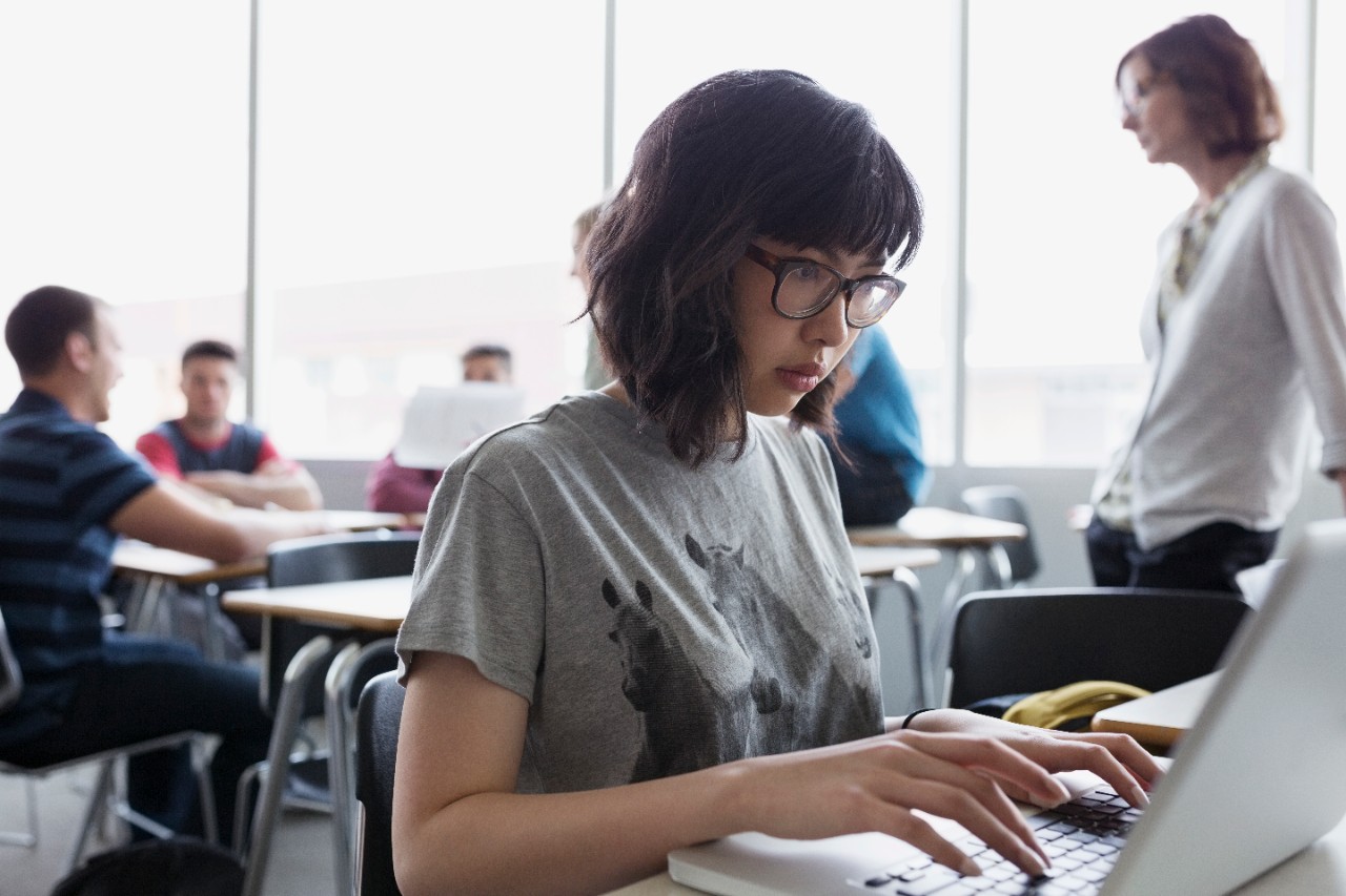 A girl is using her laptop; image used for HSBC Malaysia Premier Education Help Your Child Study Abroad article