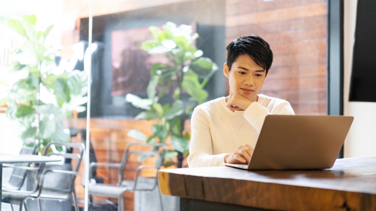 A boy is watching his computer; image used for HSBC Malaysia Jompay