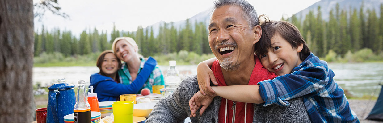 A child is hugging his grandpa; image used for HSBC Basic Current Account page.