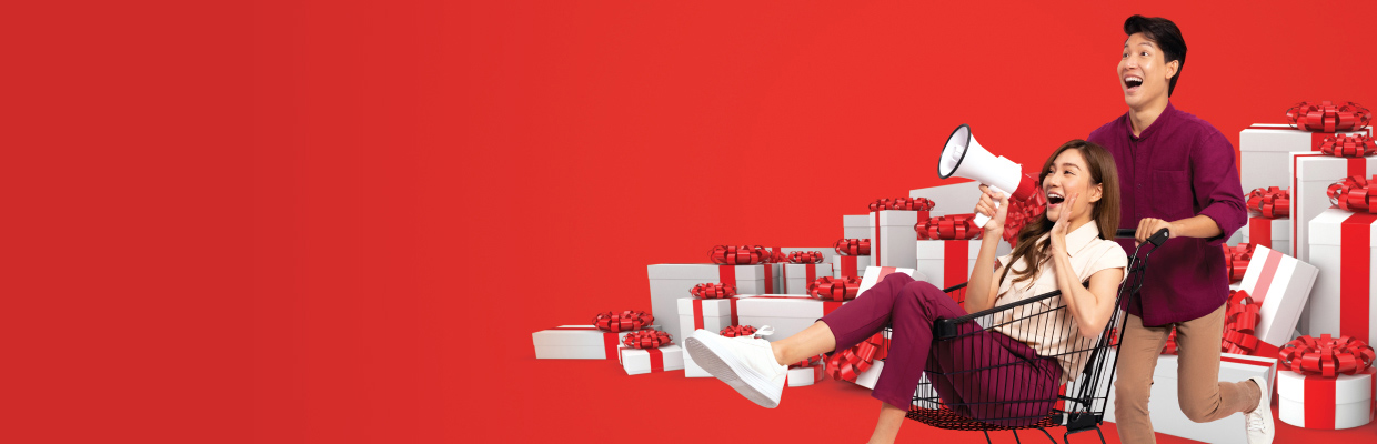 A woman using binoculars with shoppingbags; image used for HSBC Malaysia credit cards 2020 cash back offer