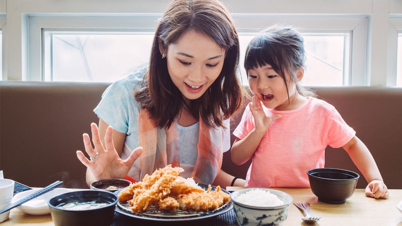 Mom and daughter are preparing the food; images used for HSBC Amanah Visa Debit Cards-i.