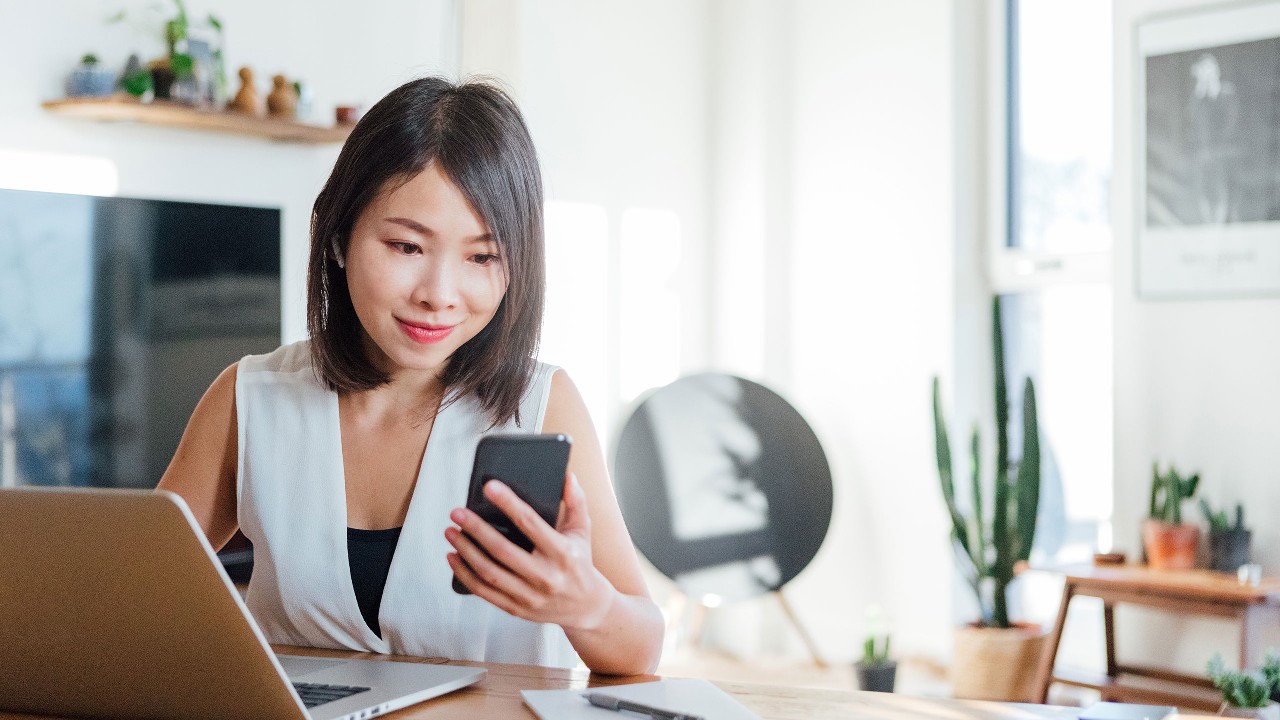 Woman on smart phone; image used for HSBC Malaysia plan for the future article page