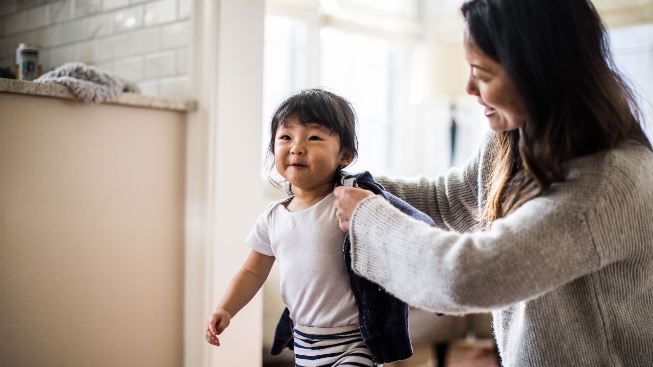 Mother take care of her daughter; image used for HSBC's ProtectCare Plan page.