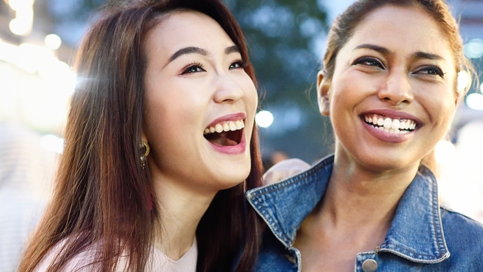 Two women are smiling; image used for HSBC Malaysia 7 Great Ways to Use Extra Cash Article