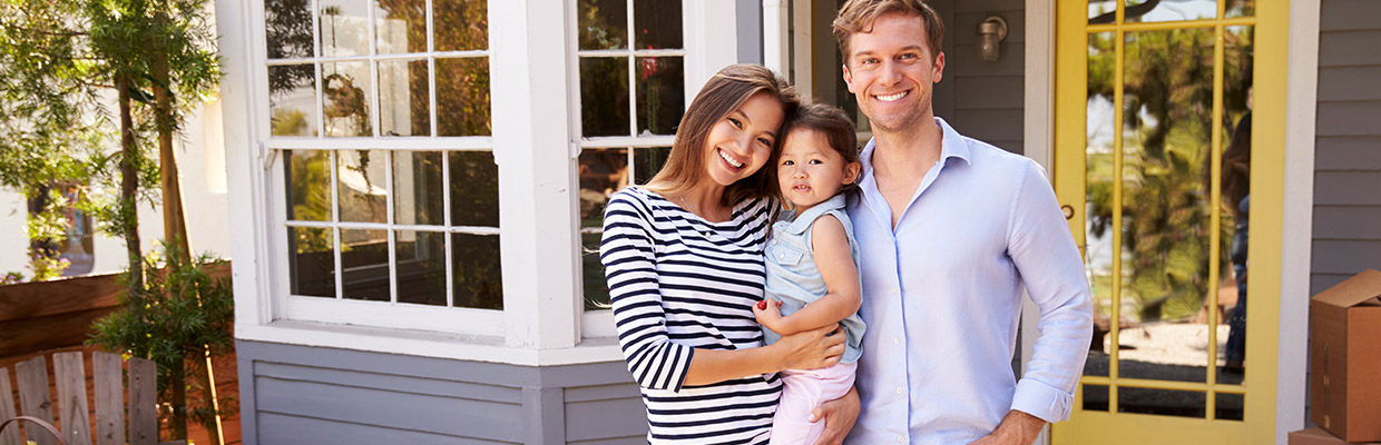 A family is in front of their home; image used for HSBC Malaysia Ideal Home Mortgage