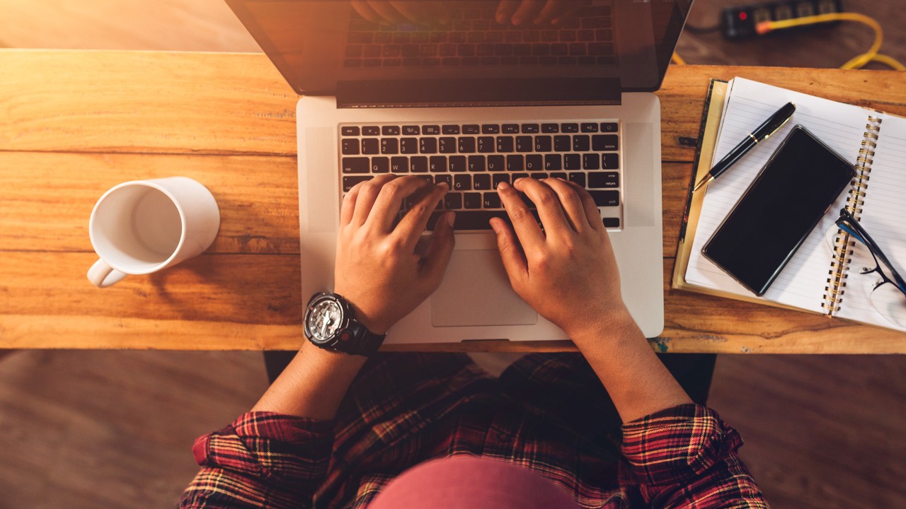 A businessman typing on his laptop; image used for HSBCnet upgrade for small business page - simplified business banking section.