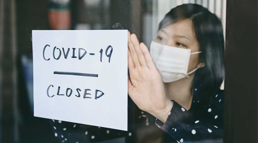 A shop owner closed her business; image used for HSBC Malaysia Fusion ‘Managing your SME business through COVID-19’ article.