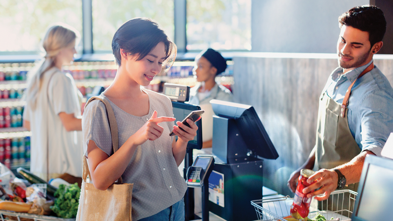 A woman shopping in the grocery store; image used for HSBC Fusion Basic Current Account.