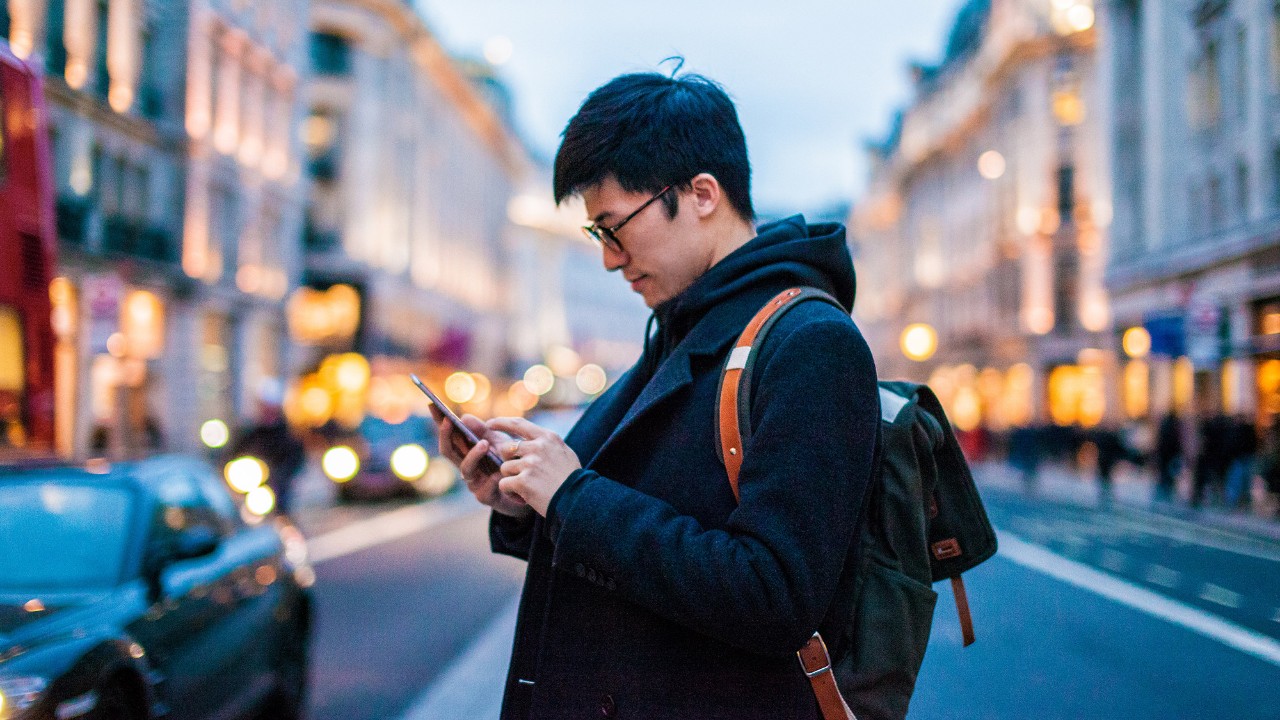 A man is using a tablet; image used for HSBC Malaysia Online banking page.