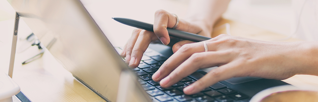 Both hands are typing; image used for HSBC Malaysia Safe internet banking page.